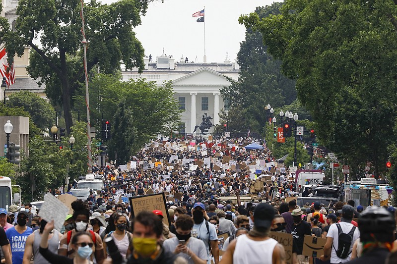 Demonstrators protest Saturday near the White House in Washington, over the death of George Floyd, a black man who was in police custody in Minneapolis. Floyd died after being restrained by Minneapolis police officers. (AP Photo/Jacquelyn Martin)