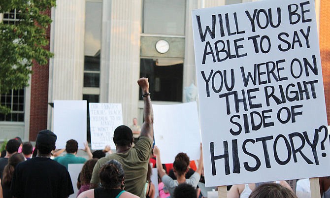 Protesters knelt, raised their hands and hoisted signs in front of the Callaway County Courthouse while chanting, "Silence is violence," "Say her name, Breonna Taylor," "Say his name, George Floyd" and "No justice, no peace, prosecute the police."