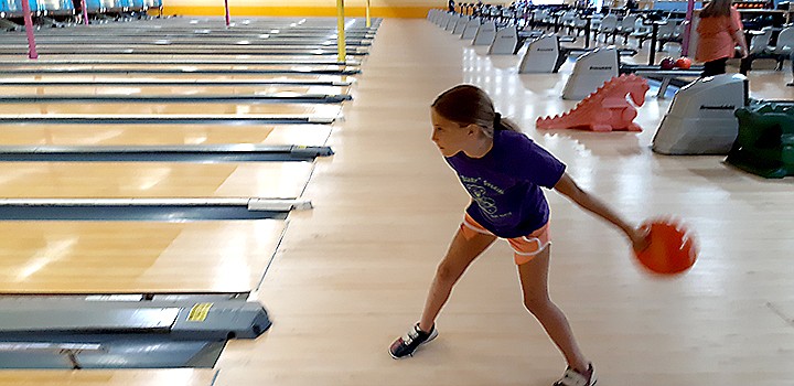 Allie Goodrich  aims at the pins while bowling with her family Thursday afternoon at Holiday Bowl in Texarkana.