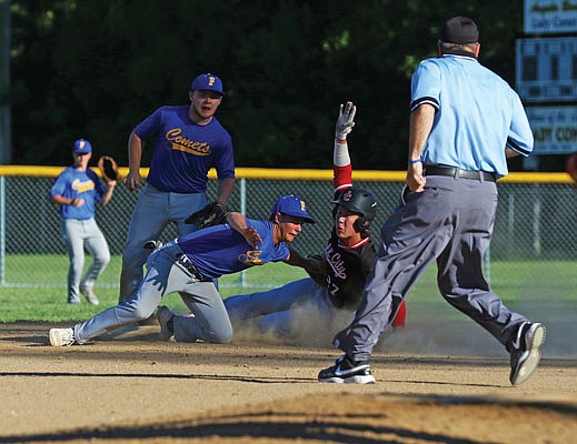 Taylor Hopkins of the Jays reaches second base just before Fatima shortstop Blake Gentges applies the tag during the first game of Thursday night's doubleheader in Westphalia.