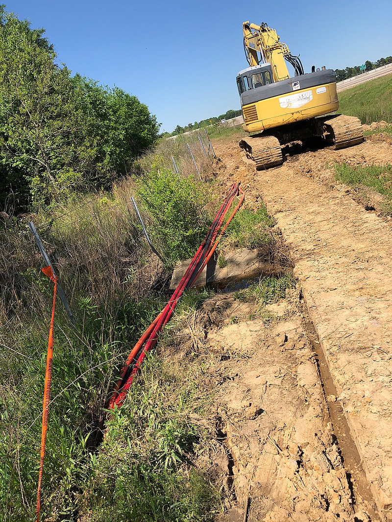 Ritter Communications crews work installing hundreds of miles of fiber optic cable. The $16 million project is expected to be completed by year's end.