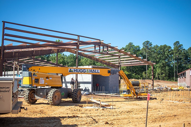 Workers lay the framework for the new middle school for the Texarkana Arkansas School District. The back of the school is located across from Holiday Springs Water Park, but the front entrance faces Jefferson Avenue. (Staff photo by Sara Vaughn)
