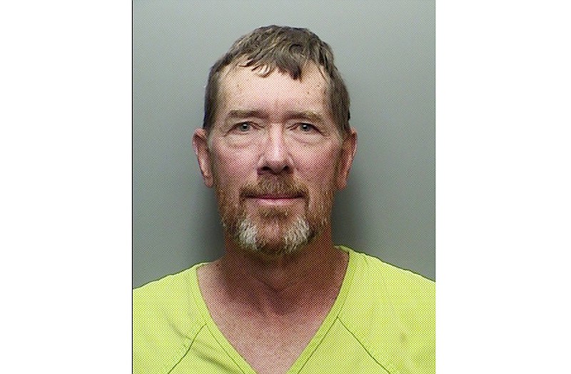 This undated booking photo released by Loveland Police Department shows Scott Gudmundsen. Authorities have arrested the Colorado man they say held at gunpoint two roofing-company employees knocking on doors in his neighborhood. Both were wearing blue polo shirts with a local roofing company logo when Gudmundsen forced them to the ground on Thursday, June 11, 2020, police told KUSA-TV. (Loveland Police Department via AP)