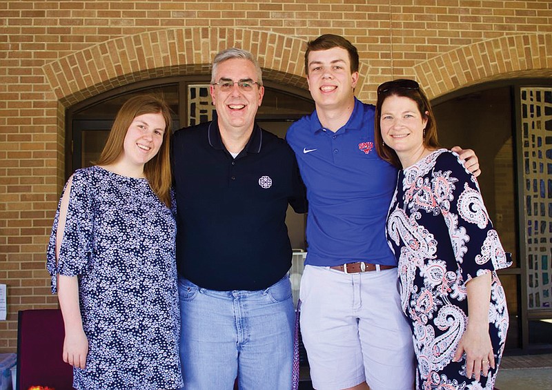 Brad Morgan, second from left, and his family, Kate, far left; John, second from right; and Laura, right, bid farewell to the congregation of Williams Memorial United Methodist Church after Brad's last service as pastor.