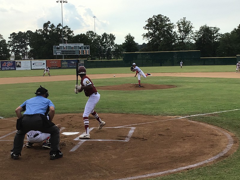 Texarkana Bulldog pitcher Ryan Galvan pitches to Texarkana Razorback batter Roc Hawthorne during a Senior American Legion Baseball game Tuesday at George Dobson Field. 