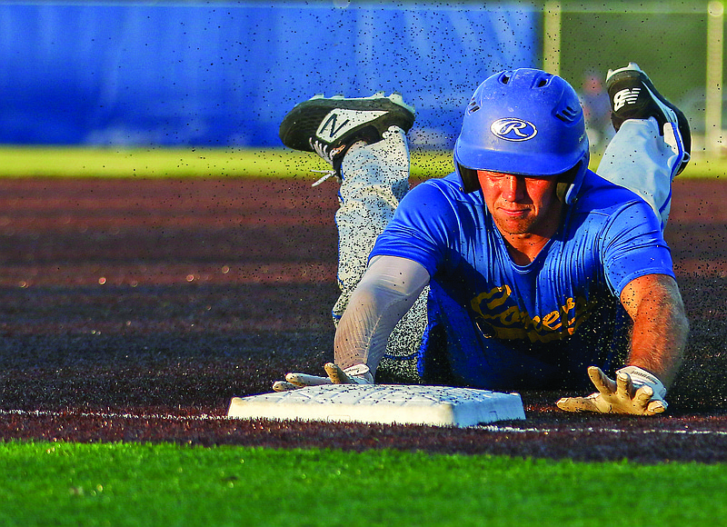 Fatima's Brandon Dulle steals third base during Tuesday night's game against Capital City at Capital City High School.