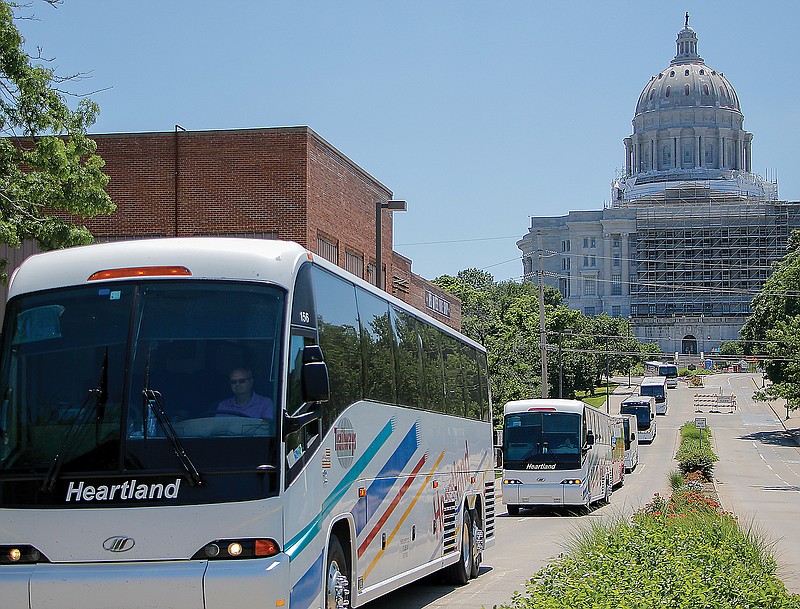 Almost 20 busses round the Missouri state Capitol on Wednesday to bring awareness to bus companies being left out of the CARES Act.