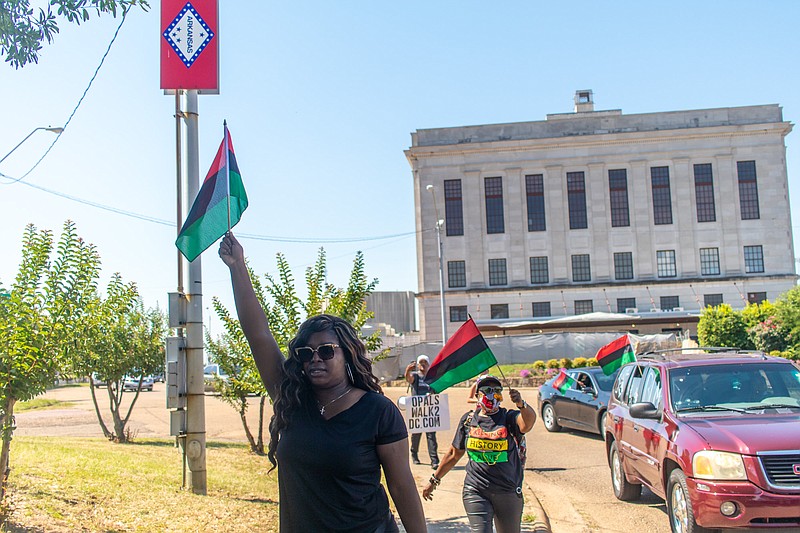 A caravan travels down State Line Avenue during Texarkana's "Opal's Walk" on Juneteenth. A caravan traveled two and a half miles to symbolize the two and a half years between emancipation and enslaved Texans being freed in 1865.