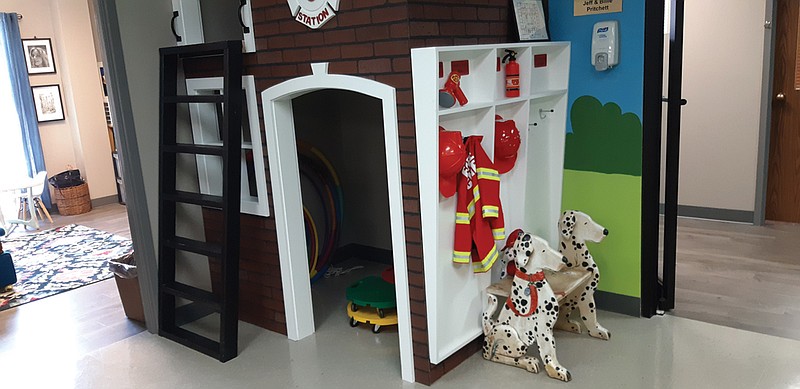 Tour guides led guests through the various play therapy areas of Temple Memorial Pediatric Center's new facility on Friday. The area is made up of multiple rooms designed along different themes and features. Some of them are sponsored by local organizations, businesses and individuals and in many cases, the features are built around the function of the business that sponsored them, such as a bank, medical clinic or firehouse.