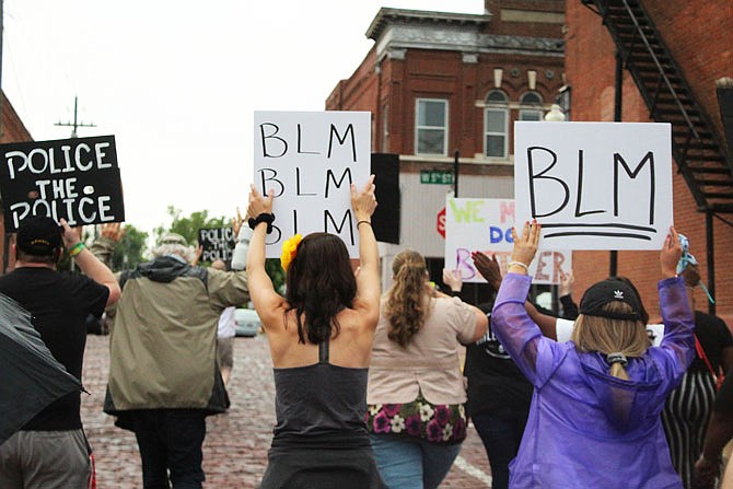 Dozens of people marched through the Brick District during Fulton's second protest this month.