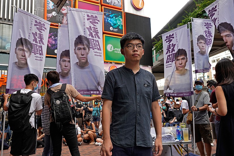 Hong Kong activist Joshua Wong poses for a photo after an interview as he attends an activity for the upcoming Legislative Council elections in Hong Kong Saturday, June 20, 2020. Wong said Thursday that opposing a draft national security law for Hong Kong "could be my last testimony (while) I am still free." (AP Photo/Vincent Yu)