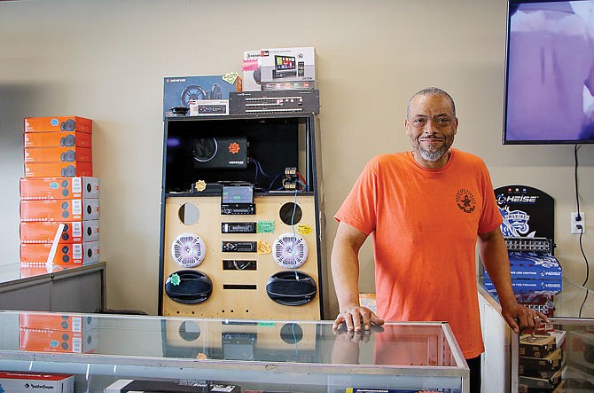 Ricardo "Ricky" Finney is shown behind the counter of Just For You Custom Accessories, a small car accessory shop he owns on Missouri Boulevard. Finney has run the shop since the 1990s. Aside from car accessories like stereo systems and tire rims, Just For You also installs vehicle security systems, trackers and breathalyzer machines.