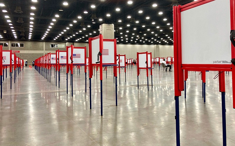 Voting stations are set up for the primary election at the Kentucky Exposition Center, Monday, June 22, 2020, in Louisville, Ky. With one polling place designated for Louisville on Tuesday, voters who didn't cast mail-in ballots could potentially face long lines in Kentucky's unprecedented primary election. 