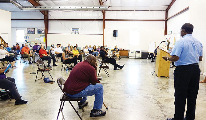 The Rev. Charles Jackson, right, pastor at Guiding Light Missionary Baptist Church, helped organize Monday's community forum. The forum brought together representatives from law enforcement, local government, the schools and the community to discuss race in Fulton.