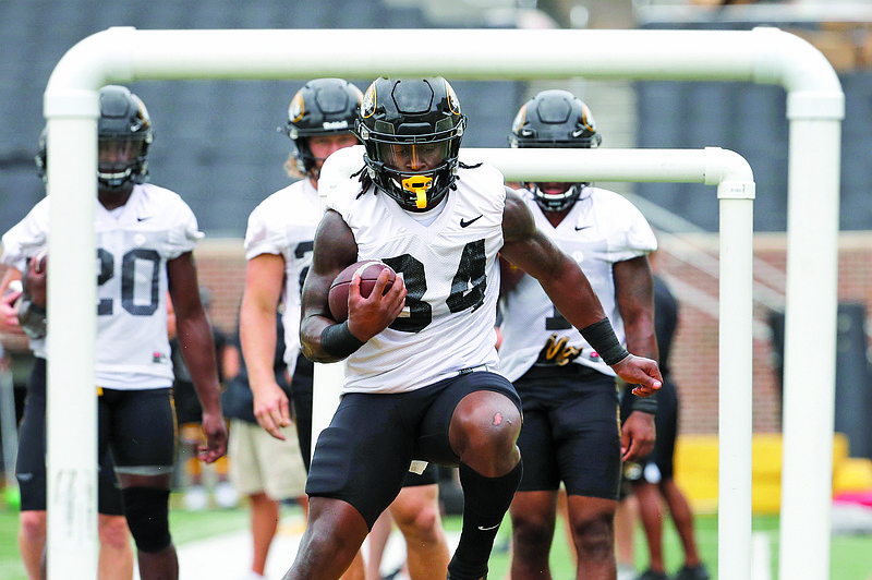 In this Aug 12, 2019, file photo, Missouri running back Larry Rountree III takes part in a drill during practice at Faurot Field in Columbia.