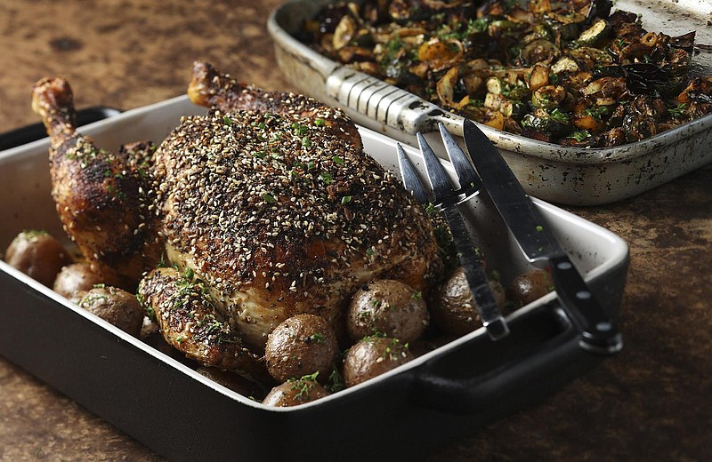 A whole chicken is roasted with potatoes, and both are seasoned generously with everything bagel spice blend. Buy your favorite brand, or make it yourself with our recipe. (Shannon Kinsella/food styling) (Abel Uribe/Chicago Tribune/TNS) 