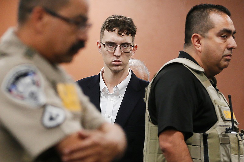 In the is Oct. 10, 2019 file photo, El Paso Walmart shooting suspect Patrick Crusius pleads not guilty during his arraignment in El Paso, Texas. Crusius, accused of killing 22 people at a Walmart Aug. 3, 2019 in Texas is expected to be reindicted Thursday, June 14, 2020 as he faces another murder charge in the mass shooting that targeted Mexicans, prosecutors said. (Briana Sanchez / El Paso Times via AP, Pool, File)