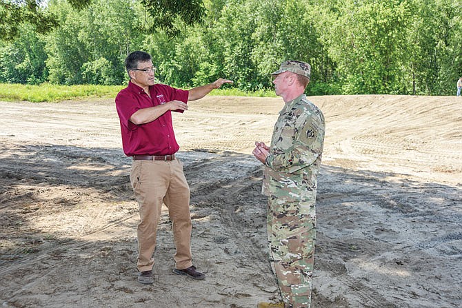 Callaway County Commissioner Roger Fischer, left, talks about levee ideas with Col. William Hannan, of the U.S. Army Corps of Engineers Kansas City District. Col. Hannan was in a farm field in North Jefferson City to highlight progress on levee rehabilitation on the Capital View and nearby levee systems. Col. Hannan spoke with area Missouri River Bottom farmers about a number of issues and answered several questions.