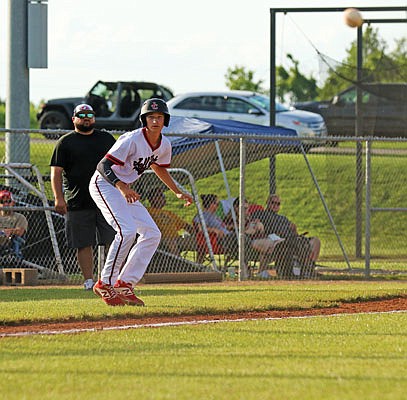 Jefferson City's Tanner Schmitz watches a pitch as he takes a lead at third base during Game 1 of Thursday night's doubleheader at New Bloomfield.