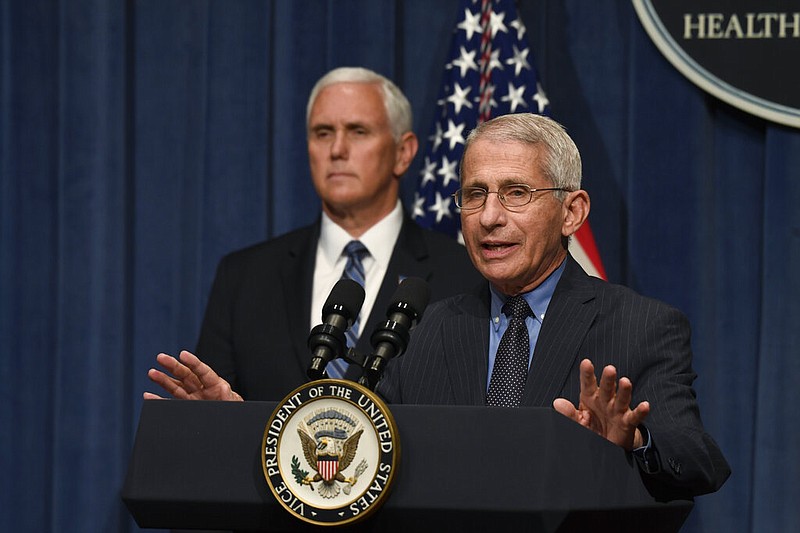Dr. Anthony Fauci, right, director of the National Institute of Allergy and Infectious Diseases, speaks during a briefing with members of the Coronavirus Task Force, including Vice President Mike Pence, left, at the Department of Health and Human Services in Washington, Friday, June 26, 2020. (AP Photo/Susan Walsh)