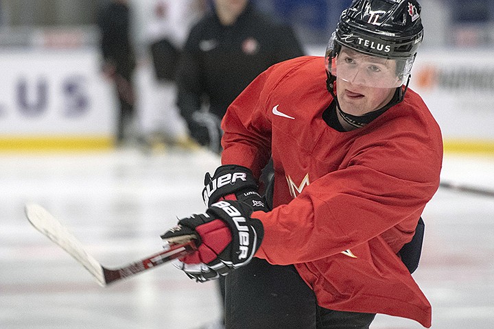  In this Jan. 1, 2020, file photo, Canada's Alexis Lafreniere shoots during the team's practice at the World Junior Hockey Championships in Ostrava, Czech Republic. The Detroit Red Wings desperately hope to win the NHL draft lottery, giving them the first shot to perhaps select Lafreniere. (Ryan Remiorz/The Canadian Press via AP, File)