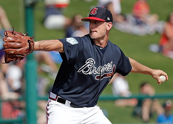 In this March 4, 2019, file photo, Grant Dayton of theBraves pitches during a spring training game against the Astros in Kissimmee, Fla.