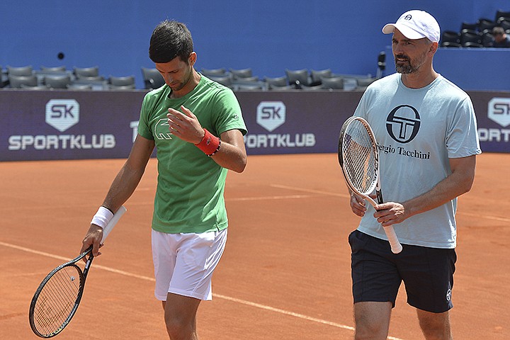 In this photo taken June 18, 2020, former Wimbledon champion Goran Ivanisevic, right, who now coaches top-ranked Novak Djokovic, right, attends a training session during an exhibition tournament in Zadar, Croatia. The Croatian great, who won his only Grand Slam title at the All England Club in 2001, wrote on Instagram that he tested positive for coronavirus after two negative tests in the last 10 days. (AP Photo/Zvonko Kucelin)