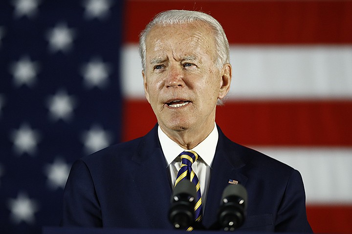 FILE - In this June 17, 2020, file photo, Democratic presidential candidate, former Vice President Joe Biden speaks in Darby, Pa. The coronavirus pandemic isn't going away anytime soon, but campaigns are still forging ahead with in-person organizing. The pandemic upended elections this year, forcing campaigns to shift their organizing activities almost entirely online and compelling both parties to reconfigure their conventions. (AP Photo/Matt Slocum)