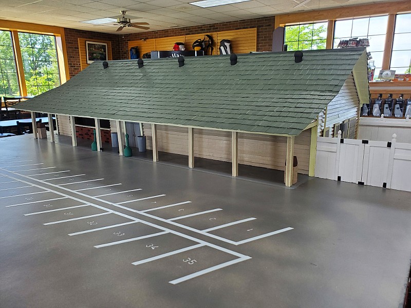 Jefferson City resident Kenny Schroeder combined his love for golf with his hobby of constructing scaled buildings by completing a replica of the clubhouse at Oak Hills Golf Center. Located inside the main entrance, the artwork is available for viewing during normal business hours. (Photo by Leann Porrello)