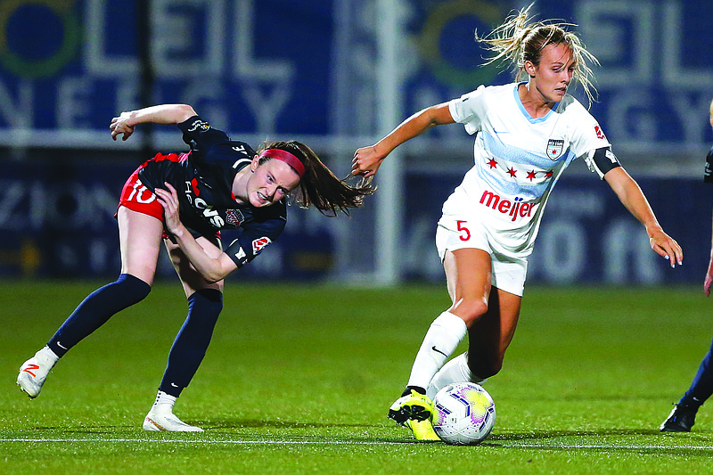 Washington Spirit midfielder Rose Lavelle (10) defends against Chicago Red Stars' Rachel Hill (5) during the second half of Saturday's NWSL Challenge Cup match at Zions Bank Stadium in Herriman, Utah.