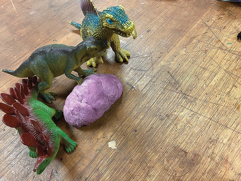 The Discovery Place interactive program had a dinosaur egg making project as part of its movie-themed month in June. Saturday's project was built around the film "Jurassic Park."
