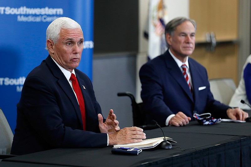 Vice President Mike Pence, left, and Texas Gov. Greg Abbott, right, respond to questions during a news conference after Pence met with Abbott and members of his health care team regarding COVID-19 at the University of Texas Southwestern Medical Center West Campus in Dallas, Sunday, June 28, 2020. (AP Photo/Tony Gutierrez)