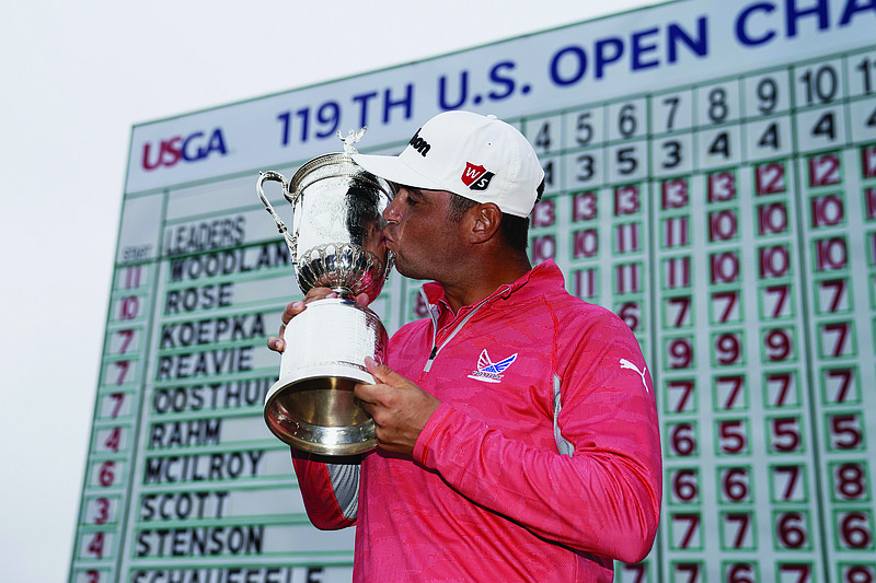 In this June 16, 2019, file photo, Gary Woodland poses with the trophy after winning the U.S. Open in Pebble Beach, Calif. The U.S. Open is returning to NBC starting this year at Winged Foot after Fox Sports has asked to end its 12-year contract with the USGA, multiple people told the Associated Press.