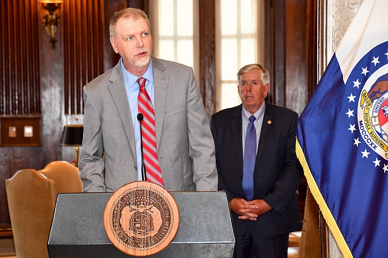 Missouri Budget Director Dan Haug speaks during a news conference Tuesday, June 30, 2020, as Gov. Mike Parson looks on.