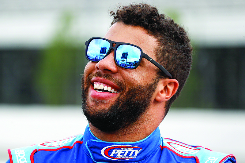 Bubba Wallace smiles before the start of Saturday's NASCAR Cup Series race at Pocono Raceway in Long Pond, Pa.