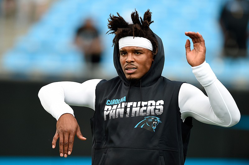 In this Sept. 12, 2019, file photo, Carolina Panthers quarterback Cam Newton warms up prior to the team's NFL football game against the Tampa Bay Buccaneers in Charlotte, N.C. The New England Patriots have reached an agreement with free-agent quarterback Newton, bringing in the 2015 NFL Most Valuable Player to help the team move on from three-time MVP Tom Brady, a person with knowledge of the deal told The Associated Press. (AP Photo/Mike McCarn, File)
