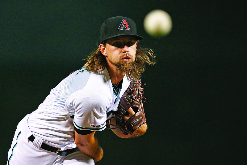 In this Sept 13, 2019, file photo, Diamondbacks starting pitcher Mike Leake warms up prior to a game against the Reds in Phoenix.