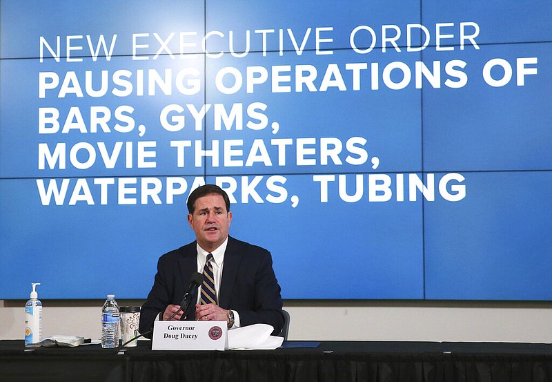Arizona Gov. Doug Ducey announces a new executive order in response to the rising COVID-19 cases in the state, during a news conference in Phoenix on Monday, June 29, 2020. The governor ordered bars, nightclubs and water parks to close again for at least a month starting Monday night — a dramatic about-face as coronavirus cases surge in the Sunbelt. (Michael Chow/The Arizona Republic via AP, Pool)
_____