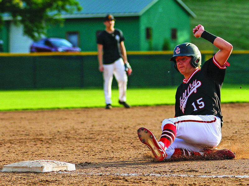 Jefferson City's Wyatt Fischer slides into third base during the first game of Tuesday's doubleheader against Fulton at Vivion Field.