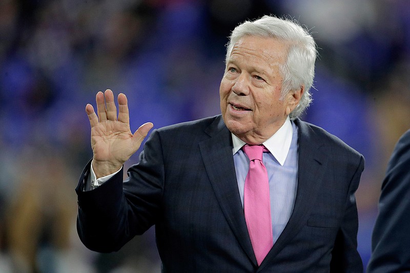 In this Nov. 3, 2019, file photo, New England Patriots owner Robert Kraft waves to fans as he walks on the field prior to the team's NFL football game against the Baltimore Ravens in Baltimore. Florida prosecutors will try to save their prostitution solicitation case against Kraft when they argue before an appellate court Tuesday, June 30, 2020, that his rights weren't violated when police secretly video recorded him allegedly paying for sex at a massage parlor. (AP Photo/Julio Cortez, File)