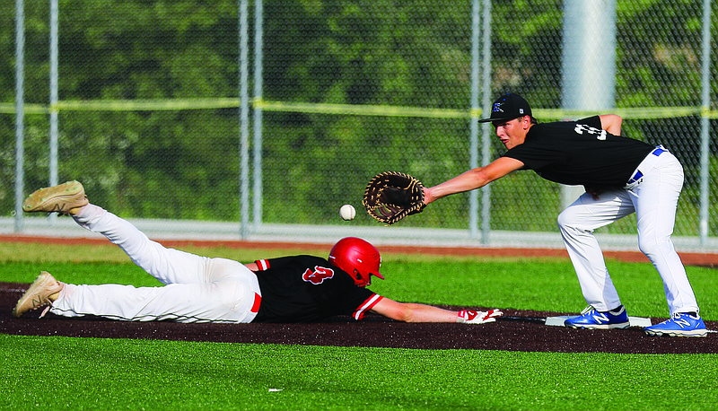 Capital City first baseman Grayson Jones reaches out to snag a pick-off attempt against a Southern Boone baserunner during Game 1 of Thursday's doubleheader at Capital City High School.