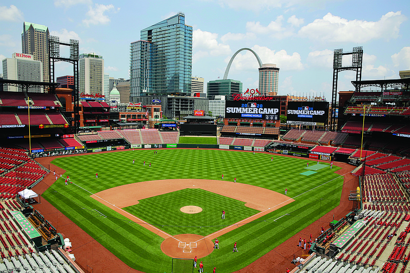 Members of the Cardinals take the field during practice Friday at Busch Stadium in St. Louis.