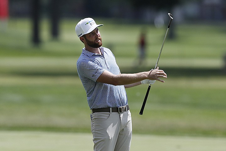 Chris Kirk watches his approach shot on the 14th fairway during the second round of the Rocket Mortgage Classic golf tournament, Friday, July 3, 2020, at the Detroit Golf Club in Detroit. (AP Photo/Carlos Osorio)