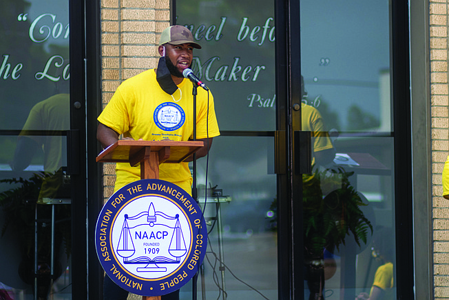 Anthony Rhone speaks at the "Where do we go from here?" rally on Friday morning. The rally had a lineup of singers, speakers and educators to discuss topics like voter empowerment, criminal justice and community involvement.