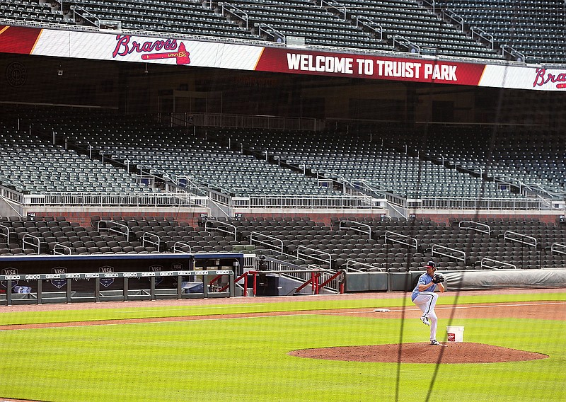 Atlanta Braves pitcher Cole Hamels appears to have Truist Park to himself while working from the mound during baseball practice, Friday July 3, 2020 in Atlanta. (Curtis Compton/Atlanta Journal-Constitution via AP)