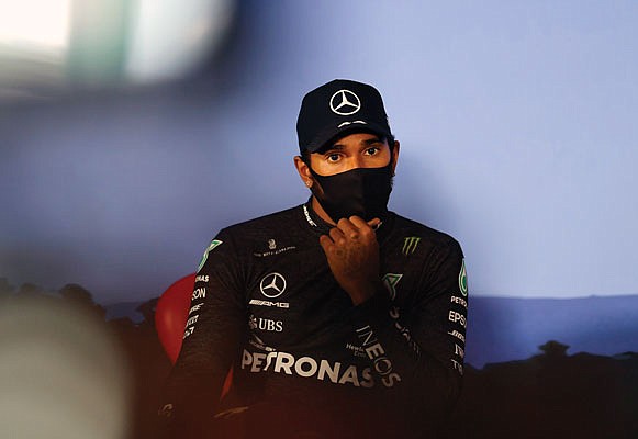 Lewis Hamilton, wearing a mask against the spread of the coronavirus, attends a press conference Saturday after he clocked the second fastest time during the qualifying session at the Red Bull Ring racetrack in Spielberg, Austria.