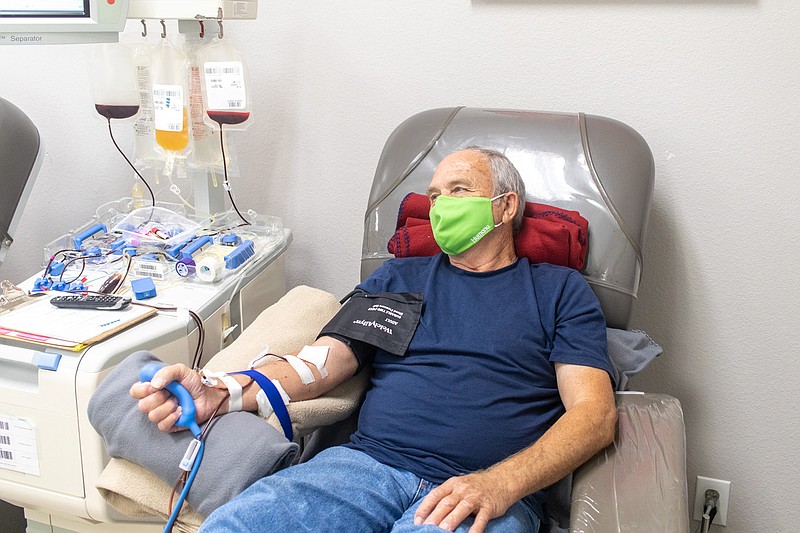 John Norman donates blood and plasma at LifeShare Blood Center on Summerhill Road. The center is open six days a week to accept donations. The center's "Independence Day Weekend United We Give" blood drive brought in nearly 1,500 donors. (Staff photo by Sara Vaughn)
