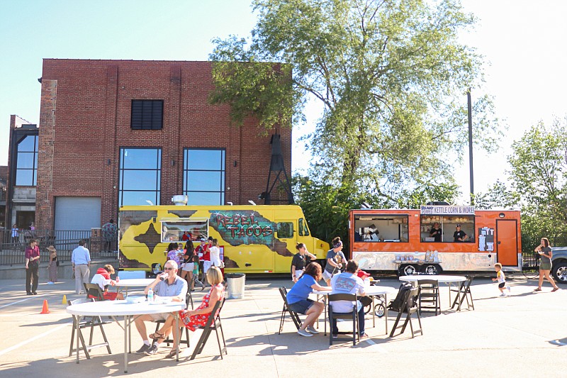 Community members gather at The Millbottom for the Food and Drink Fest hosted by Rebel Tacos and Shrunken Head Mobile Bar in June. The final event of the season is set for 5-8 p.m. Thursday.  