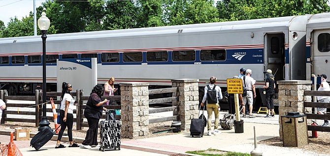 Passengers board the Amtrak train Thursday, July 9, 2020, at the Jefferson City depot.