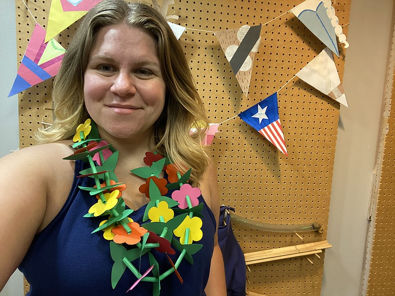 Burgandy Farris, manager of Discovery Place, shows off her her homemade lei. July's theme is Hawaii and each week's project will explore aspects of Hawaiian culture. Since travel is more limited, the Discovery Place wants to take you to place elsewhere in the world via crafts. Today, Farris will teach students how to make leis. (Submitted photo)
